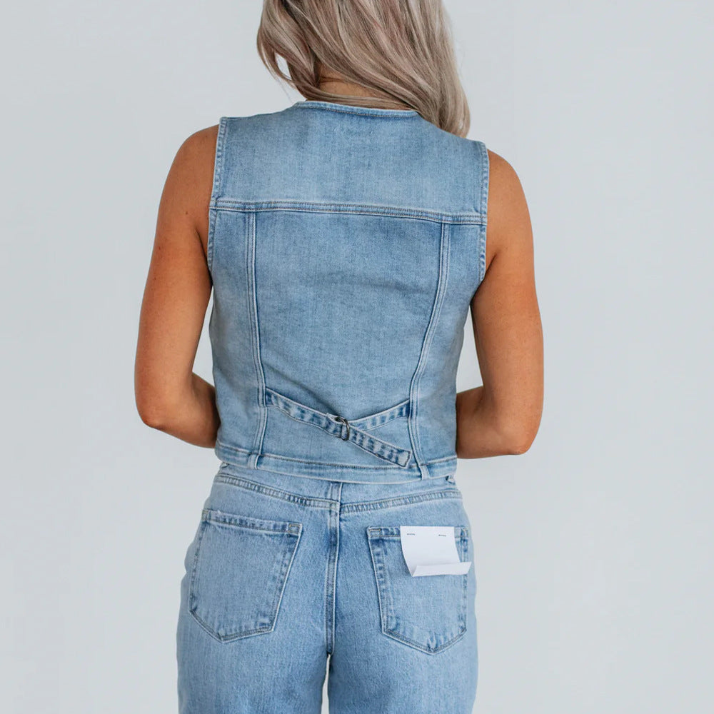 Women's denim vest with button placket and modern cut details. 4